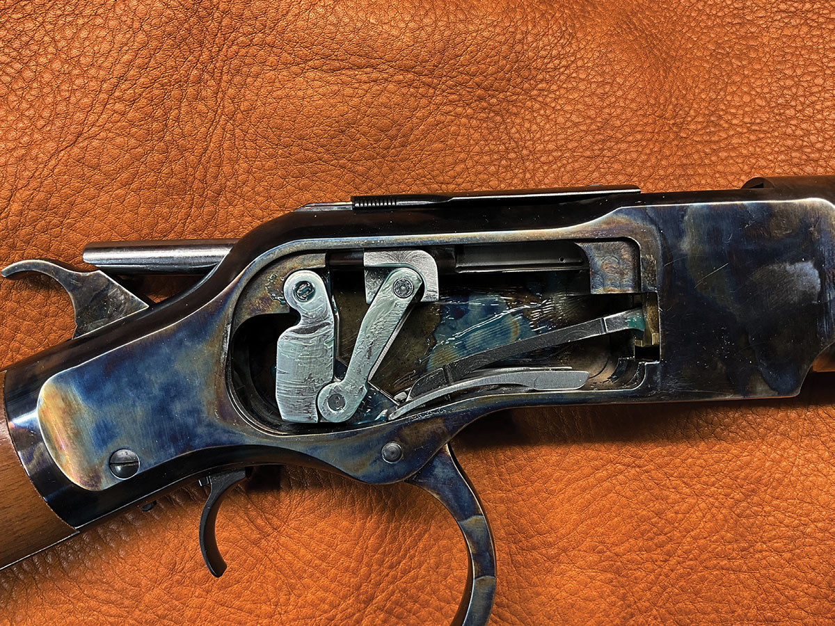 At the end of the lever stroke the hammer is cocked and a new cartridge is inline with the chamber.